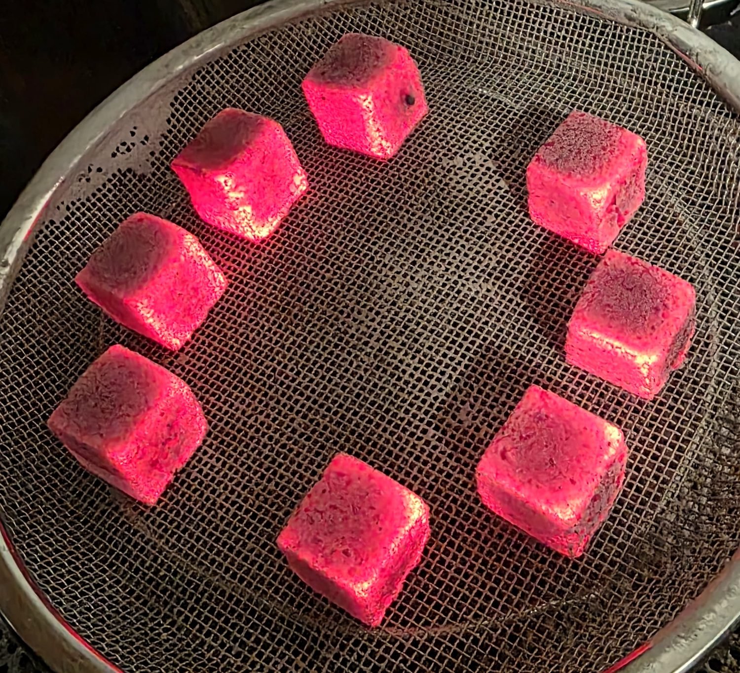 KrakaCoal coconut charcoal cubes glowing at full heat