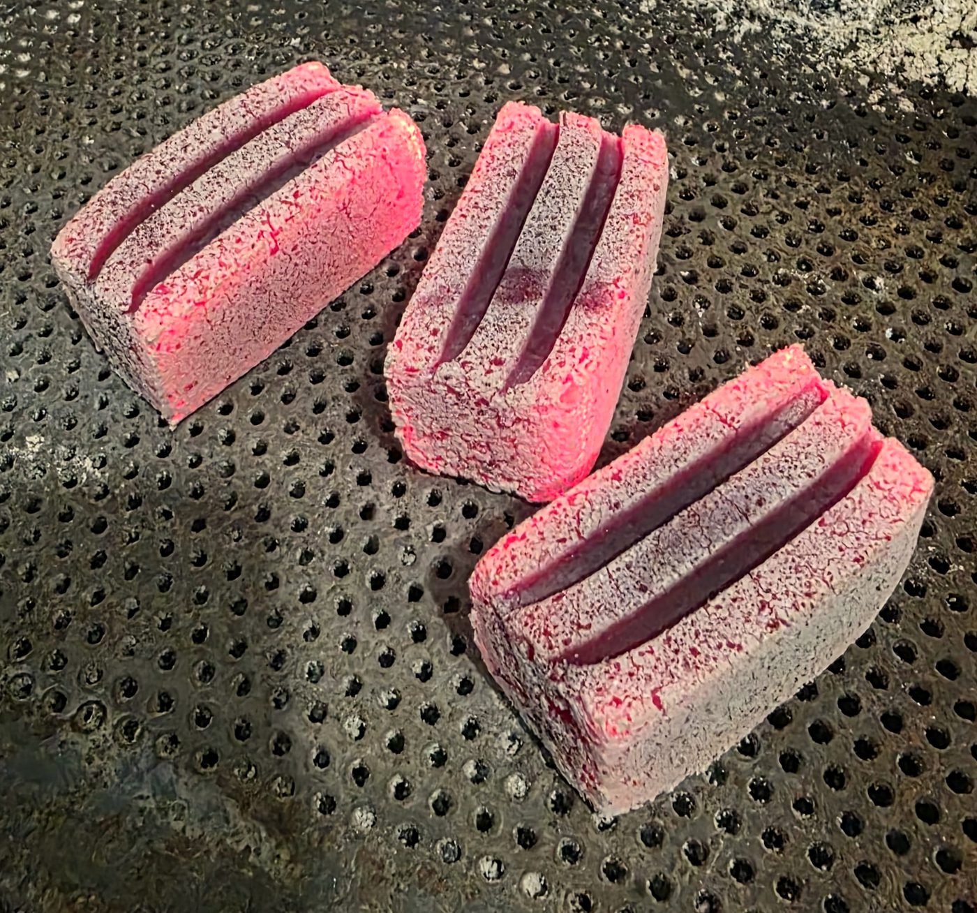 Rectangular charcoal briquette burning