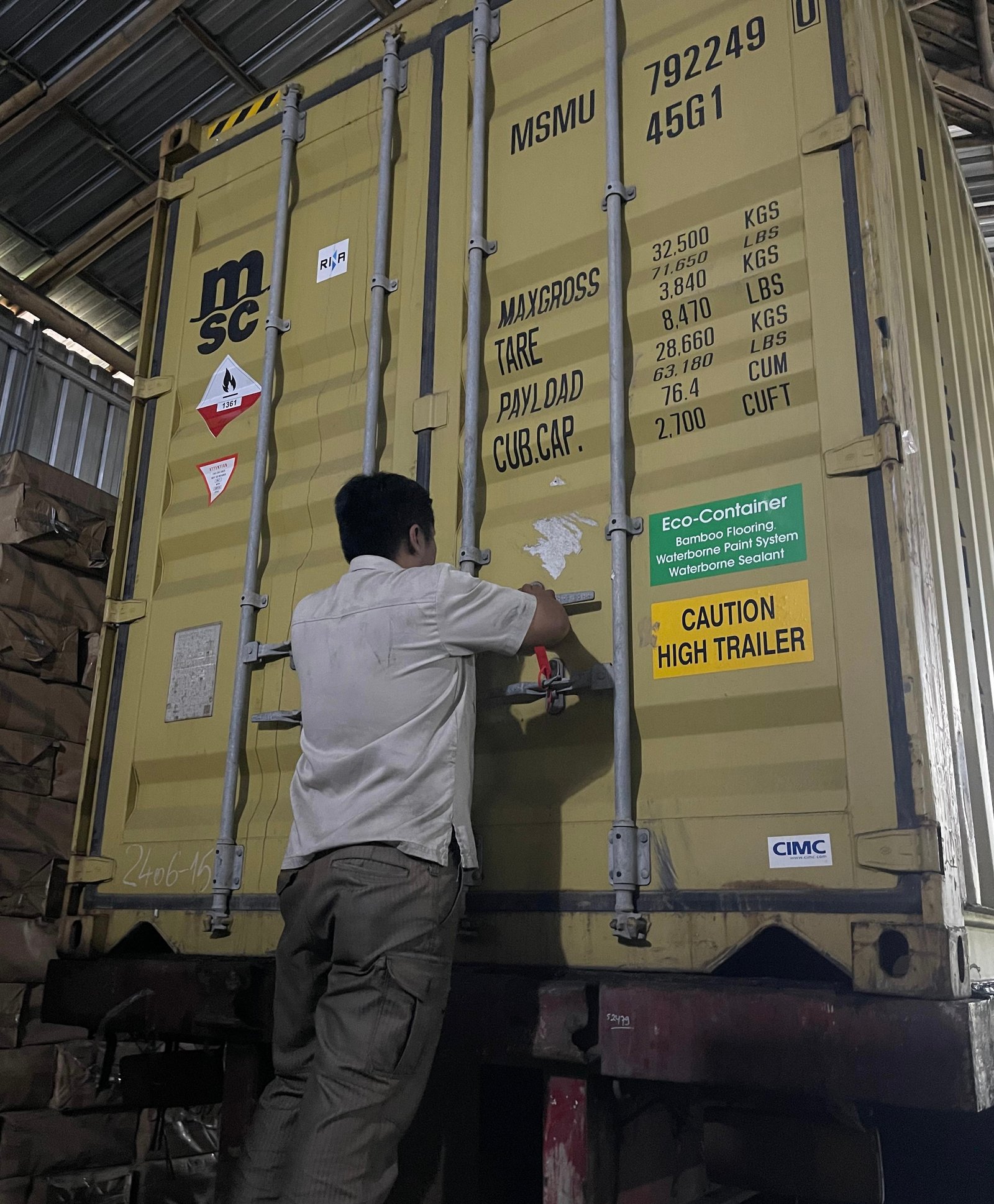 Sealed export container being locked and inspected before shipment